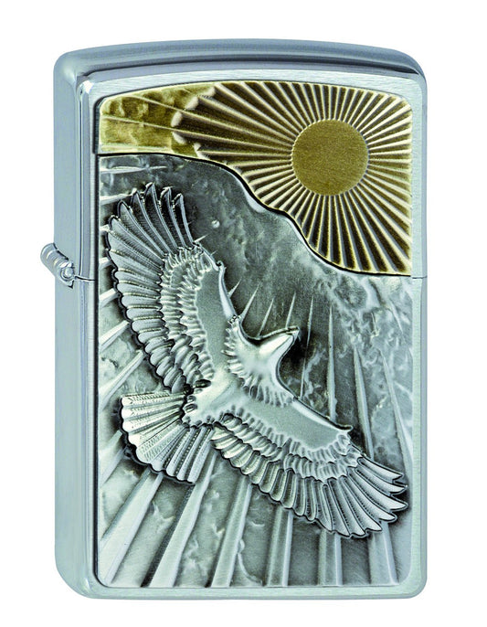 Vue de face 3/4 briquet Zippo emblème aigle volant vers le soleil